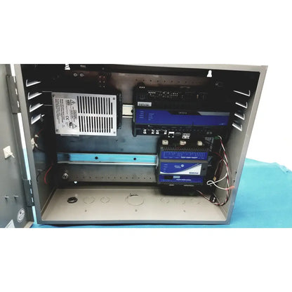 Gray metal industrial control panel housing electronic components including power supply for kryptonite cmt22a access control