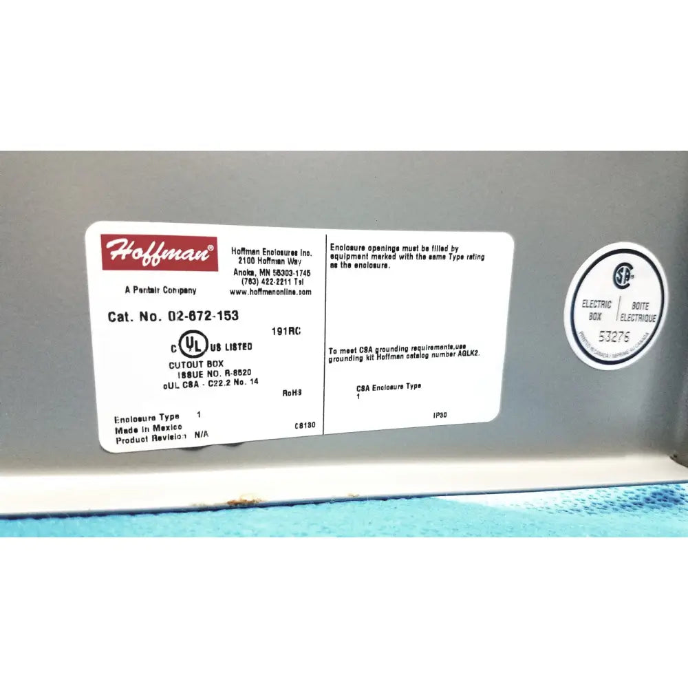 White rectangular label with red hoffman logo and product details on kryptonite cmt22a access control system