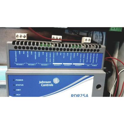 Gray and blue industrial control panel labeled johnson controls rdr2sa with ports and lights for kryptonite cmt22a access control