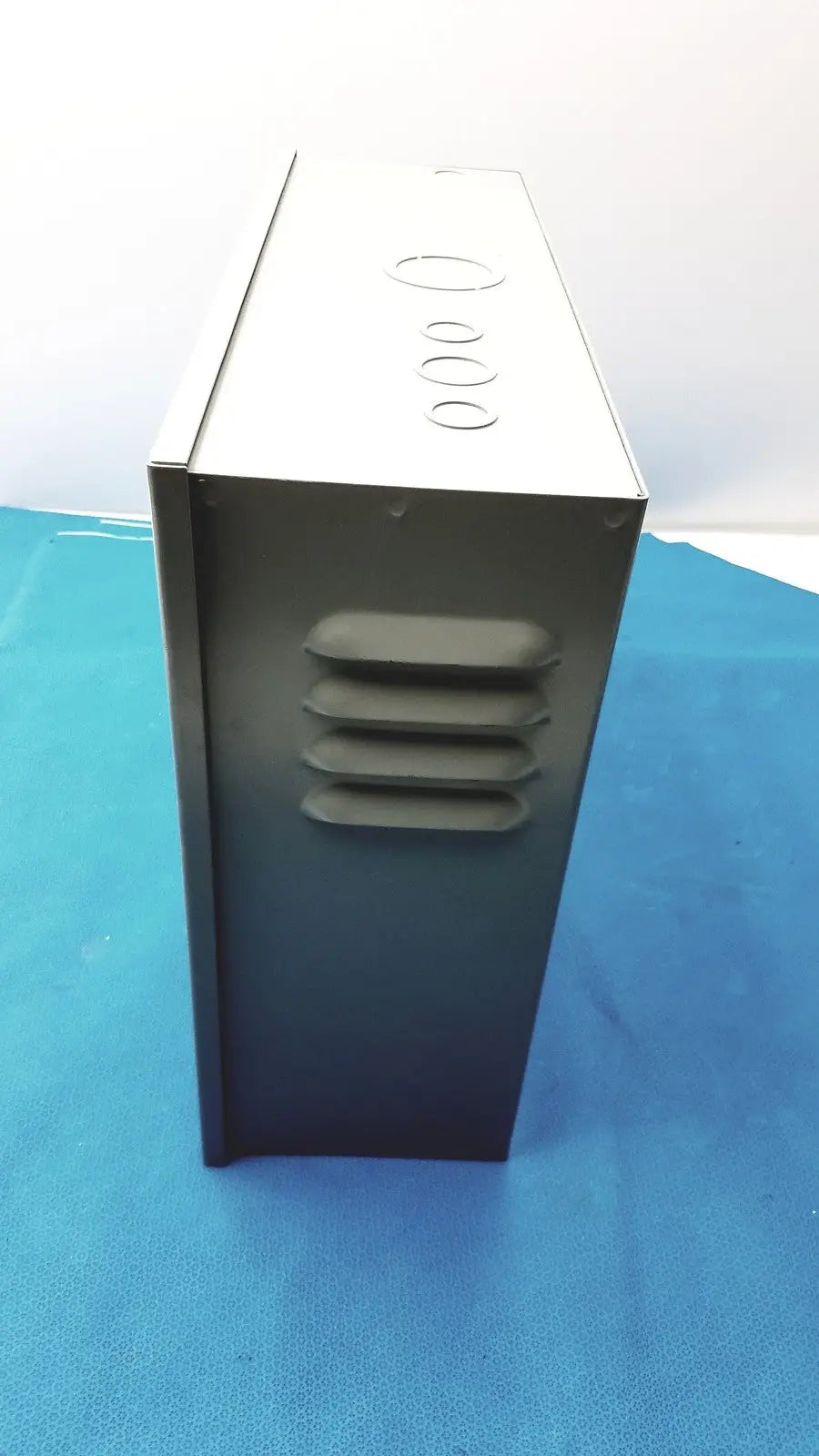 Black and silver metal computer case with circular ventilation holes on top panel for kryptonite cmt22a access control system
