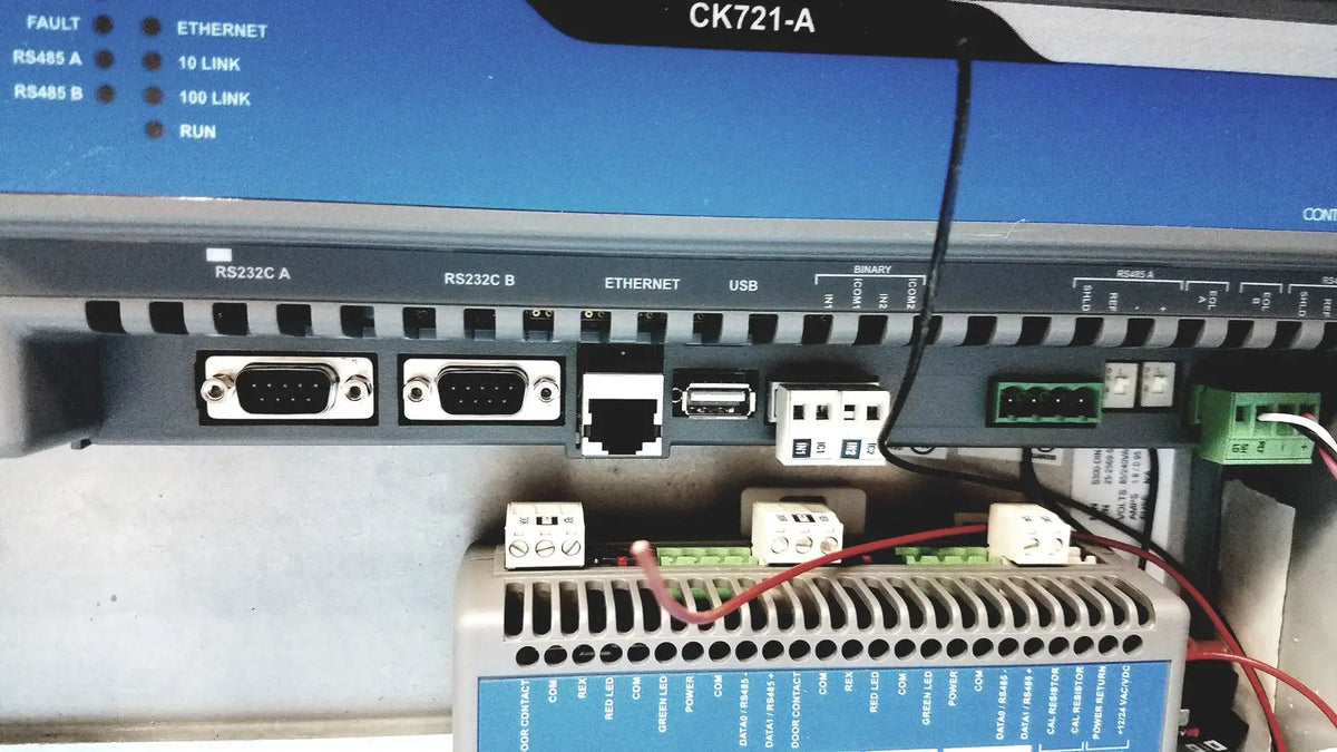 Gray industrial control panel showing multiple ports including rs232c ethernet and usb connectors on kryptonite cmt22a access control system back side