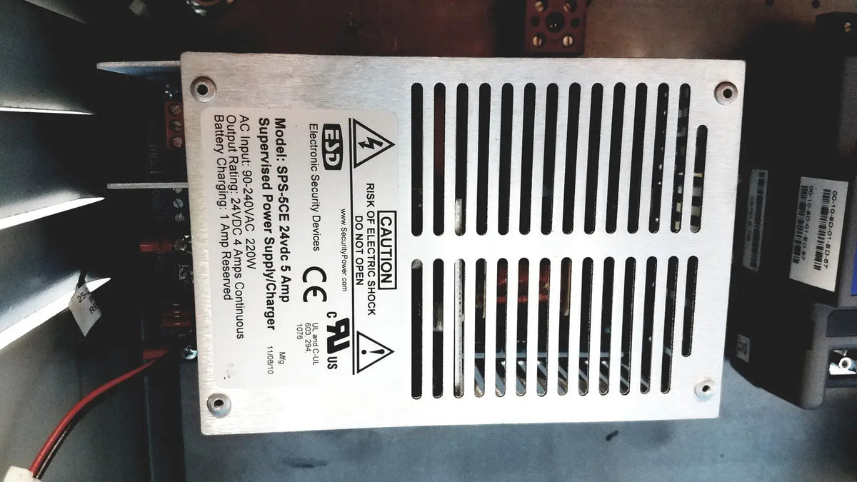 Silver metal power supply unit with vertical slotted ventilation and printed specifications for kryptonite cmt22a access control