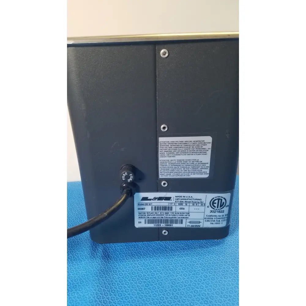 Black rectangular matte q90 ultrasonic cleaner tabletop device with multiple certification labels on back panel