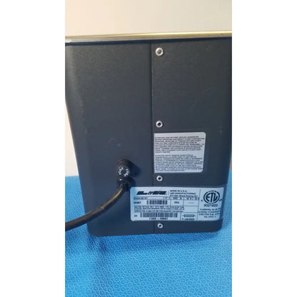 Black rectangular matte q90 ultrasonic cleaner tabletop device with multiple certification labels on back panel
