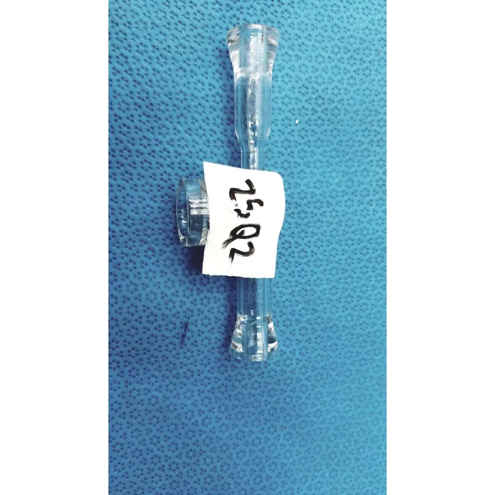 Clear plastic medical tubing with t-shaped connector labeled 20 52 for lab glass adapter with stopcock valve use