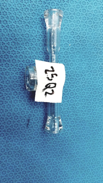 Clear plastic medical tubing with t-shaped connector labeled 20 52 for lab glass adapter with stopcock valve use