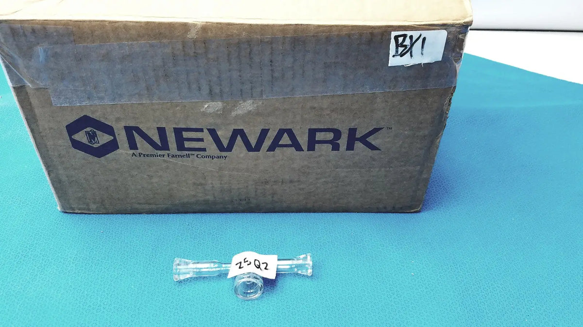 Clear glass lab glass adapter t-shaped connector with stopcock valve and white label 25 q2 affixed to center
