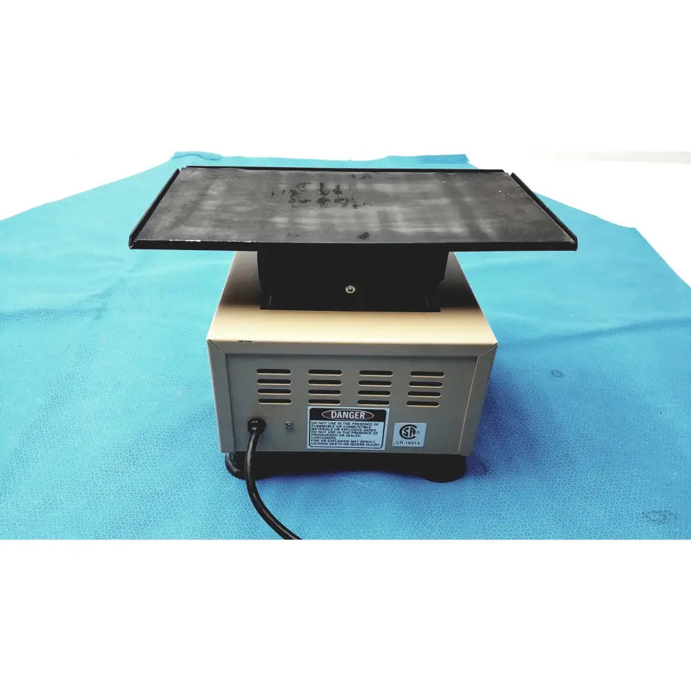 Black rectangular magnetic stirrer with beige base and ventilation slots for lab-line 4600 multi-mixer platform shaker lab equipment