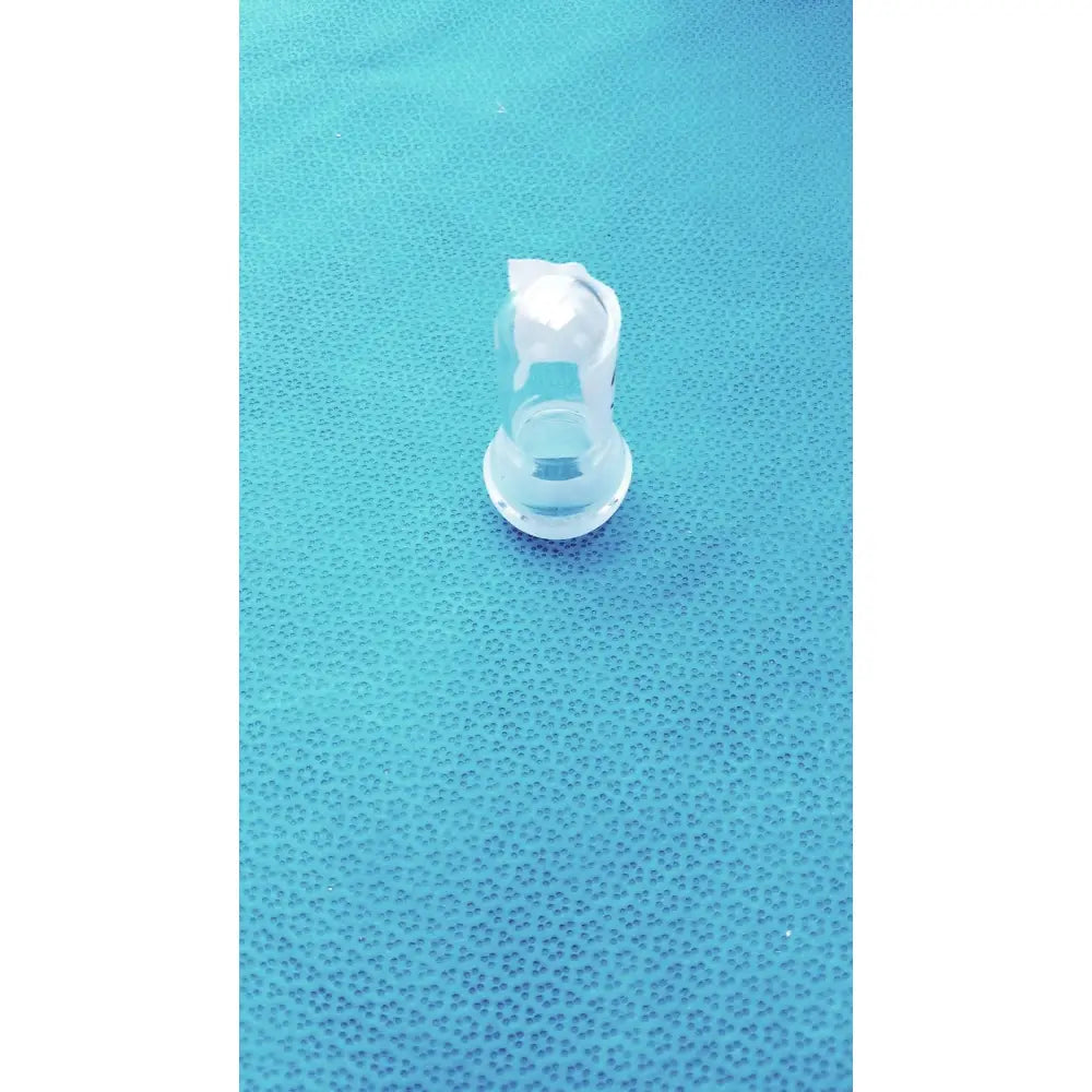 Clear plastic borosilicate lab spherical joint glass stopper with textured rounded top and flat base for sealing joints