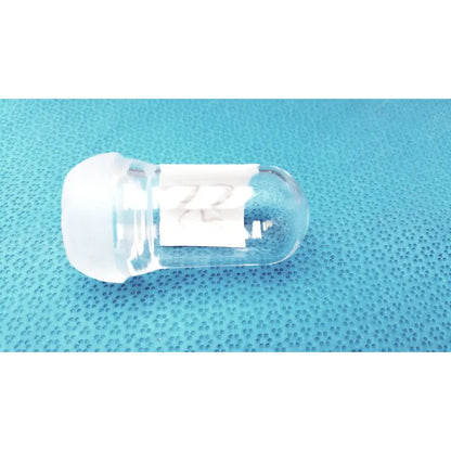 Clear glass lab spherical joint stopper with frosted white cap and small white label affixed to the side