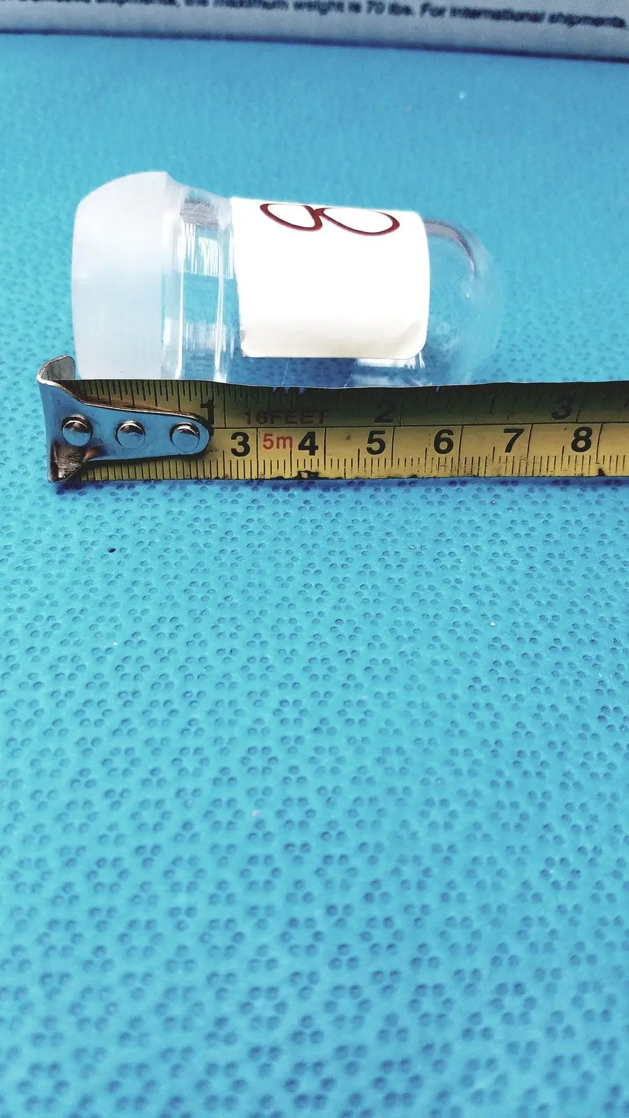 Clear plastic lab spherical joint vial with white cap and red number 8 label for spherical joint glass stoppers