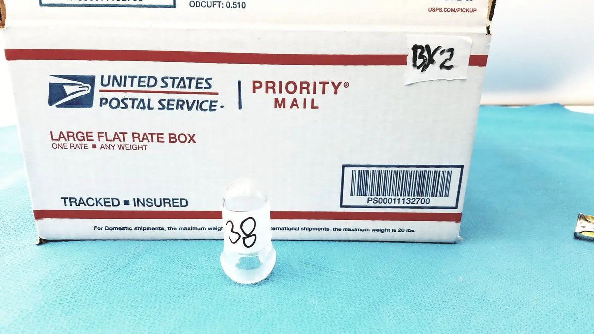 Clear plastic container with black number 38 printed on side for lab spherical joint glass stoppers storage