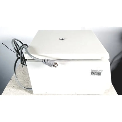 White rectangular electric labnet hermle centrifuge with gray power cord and label we manufacture entering for reuse medical
