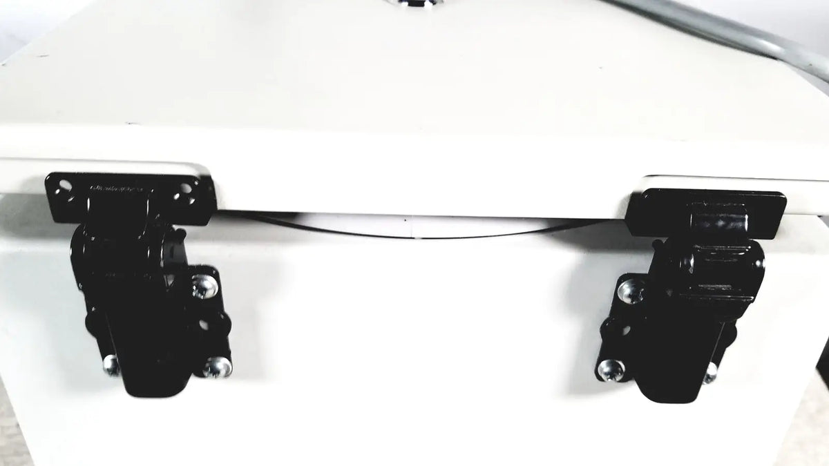 Black metal latches on white cooler of labnet hermle z 200 a centrifuge for reuse medical applications