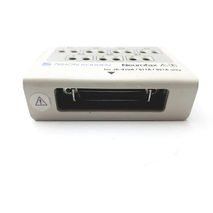 Beige laerdal compact suction unit 4 with labeled input ports and warning symbol on the back side of the device