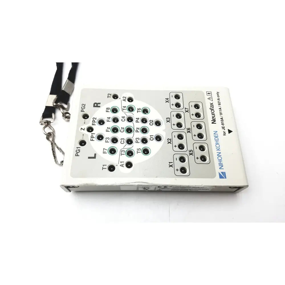 White rectangular neurofax eeg recording device with black silver labeled input ports and lanyard for laerdal compact suction unit back