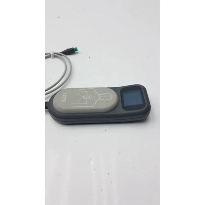 Black and gray laerdal cpr meter 453564257691 with small screen, chest compression diagram, and connected cables