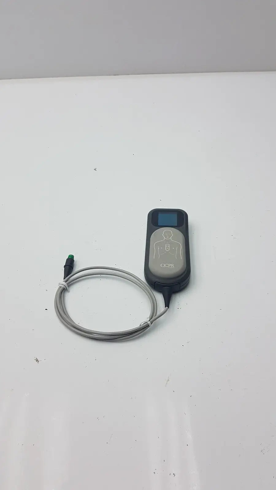 Black and gray laerdal cpr meter with coiled cable for effective cardiopulmonary resuscitation monitoring