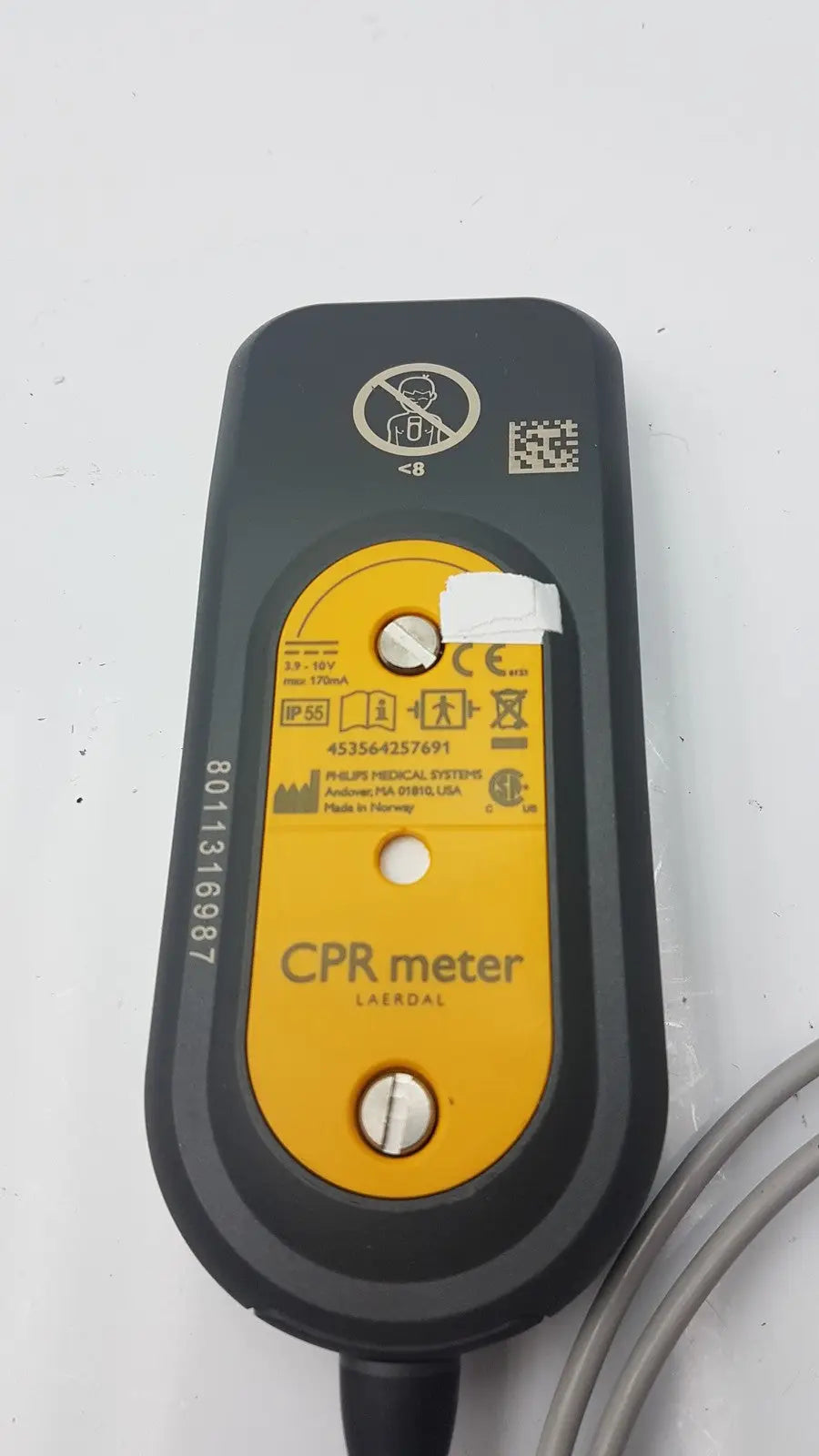 Black and yellow laerdal cpr meter with rounded rectangular design and philips label model 45356-4257691 visible