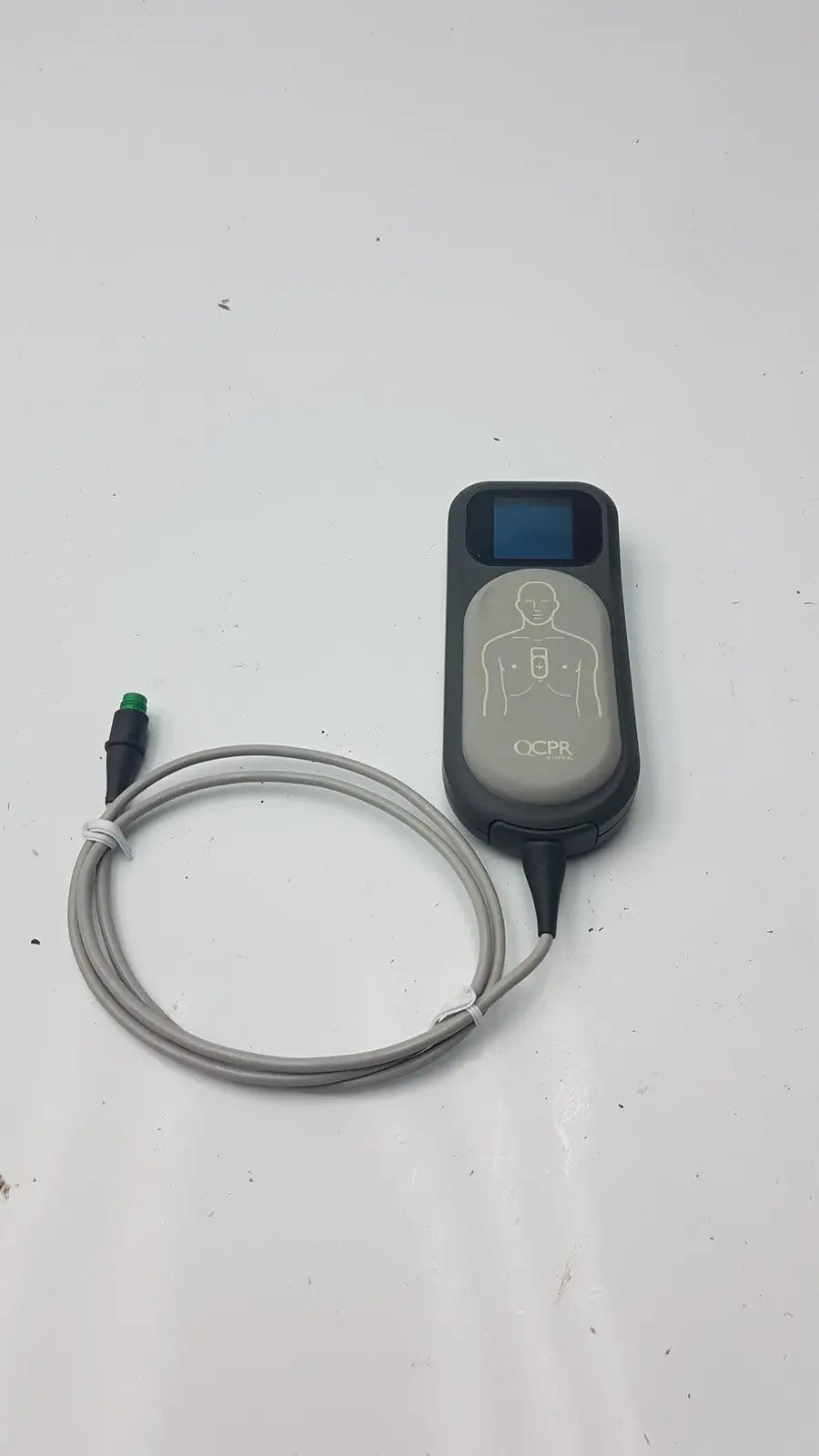 Gray and black laerdal cpr meter defibrillator monitor with coiled gray cable for emergency use