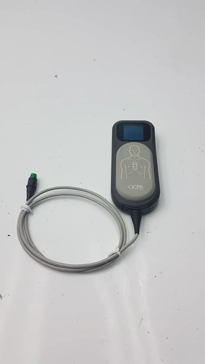 Gray and black laerdal cpr meter defibrillator monitor with coiled gray cable for emergency use