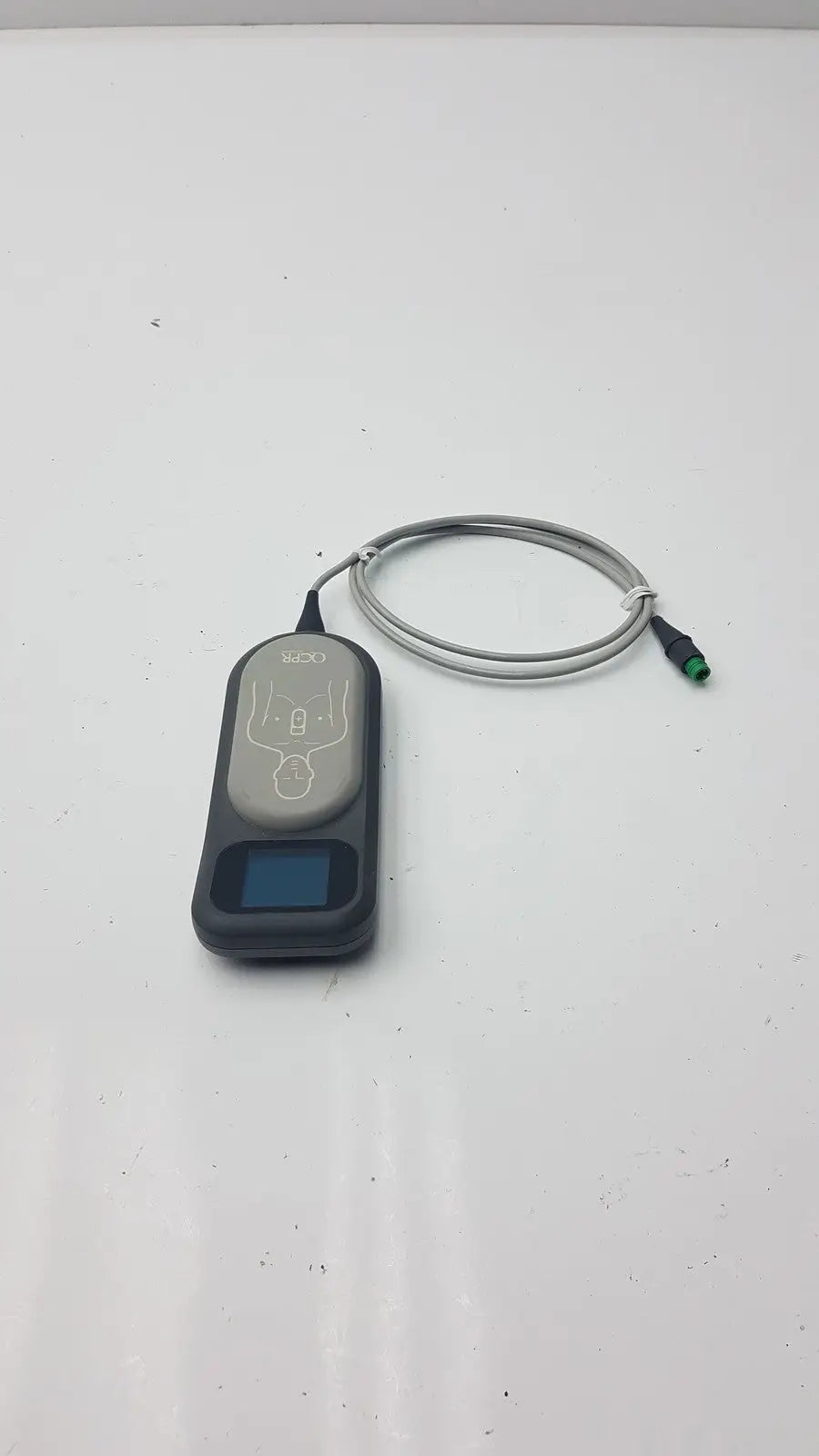 Gray and black laerdal cpr meter pediatric device with coiled cable for accurate cpr measurement and training