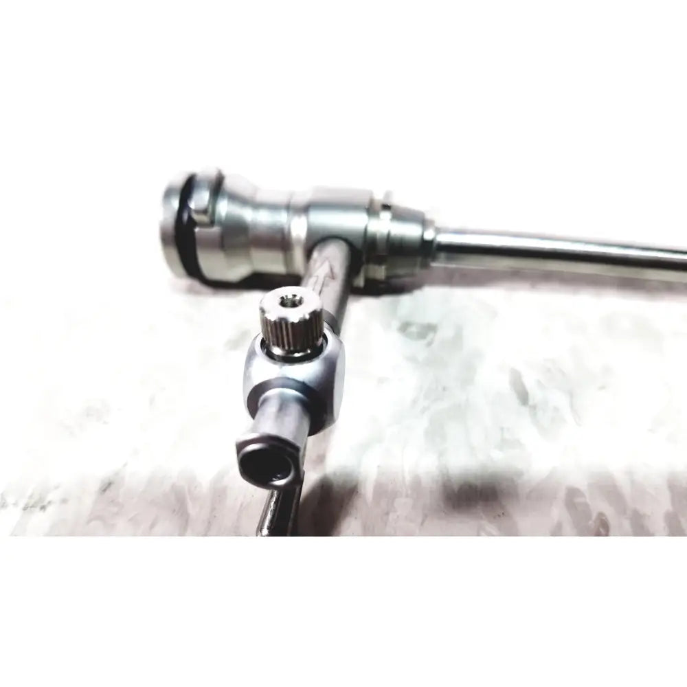Silver laparoscopic hysteroscopy diagnostic sheath with textured knob and polished metal shaft for precise endoscopy