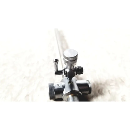 Laparoscopic obturator with 5 fr instrument featuring a silver and black gas regulator with knurled knobs for reuse medical laparoscopic instruments