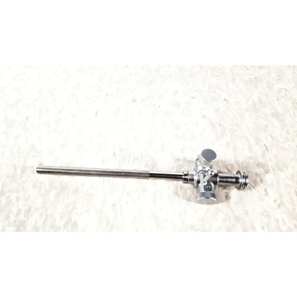 Silver-colored metal laparoscopic obturator with 5 fr instrument featuring complex valve mechanism for reuse medical procedures
