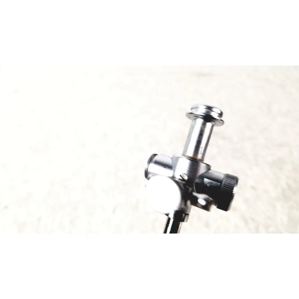 Silver metallic laparoscopic obturator with black knurled knob and cylindrical body for reuse medical laparoscopic instruments
