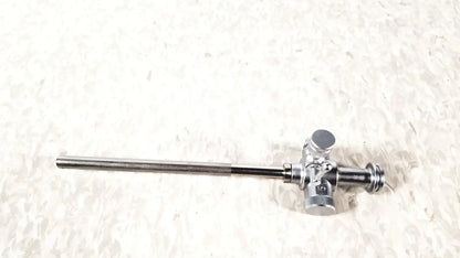 Silver-colored metal laparoscopic obturator with 5 fr instrument featuring complex valve mechanism for reuse medical procedures