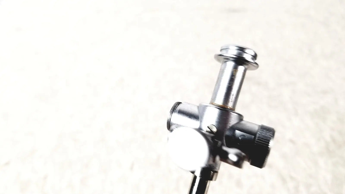 Silver metallic laparoscopic obturator with black knurled knob and cylindrical body for reuse medical laparoscopic instruments