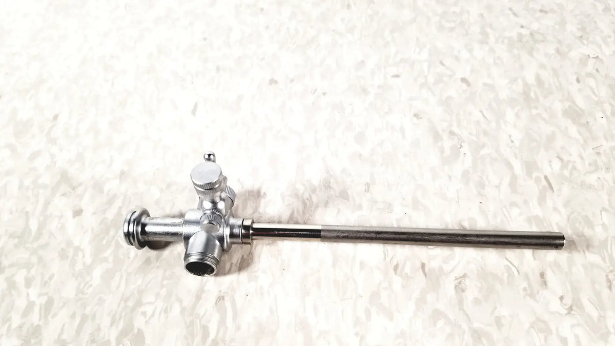 Silver metallic laparoscopic obturator with long slender shaft and three-way valve for reuse medical laparoscopic instruments