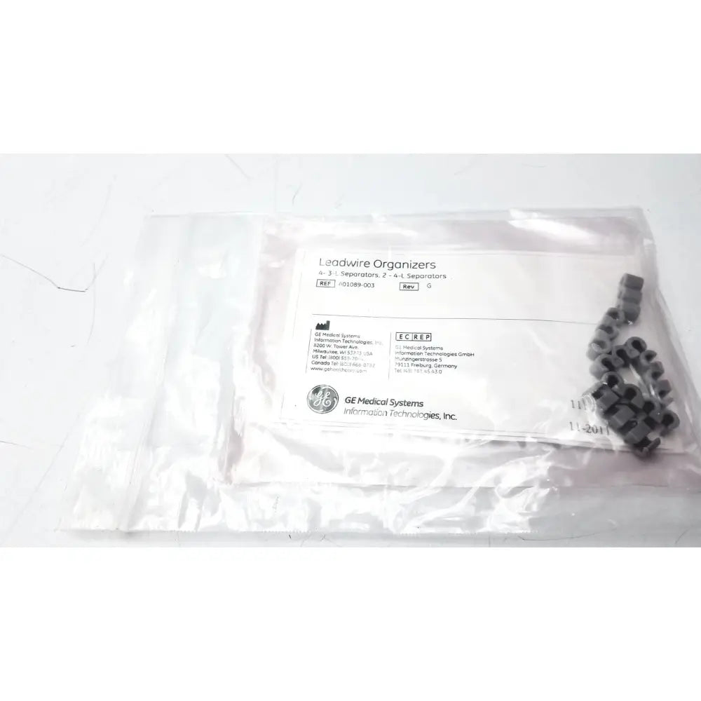 Black plastic leadwire organizer with 4 3 lead separators and 2 4 lead separators in a clear bag lead separator ref 401089-003