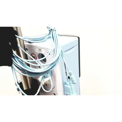 Light blue coiled cables with matching connectors wrapped around the side of a white leica eg1150h embedding center