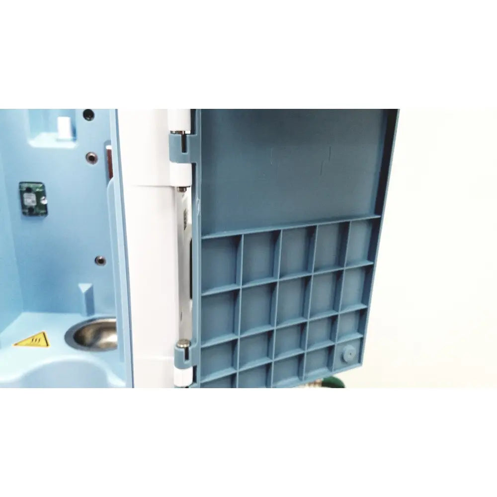 Blue plastic compartmentalized storage tray with white hinge and metallic latch for leica eg1150h embedding center