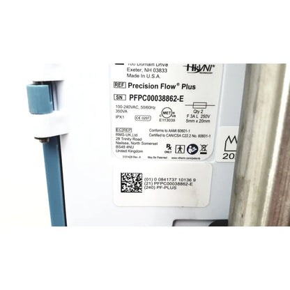 White plastic label with black text and qr code for hivin technology on leica eg1150h embedding center precision flow device