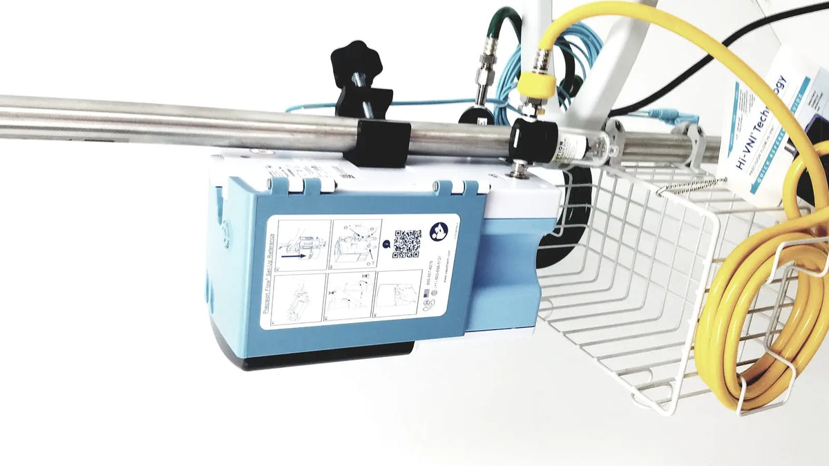 Blue and white leica eg1150h embedding center with metallic rod and instructional diagrams on side panel for lab use