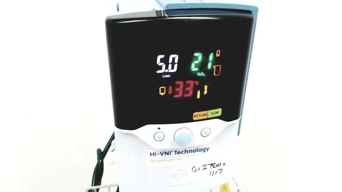 White medical ventilator with black digital display showing vital signs and hi-vni technology in leica eg1150h embedding center