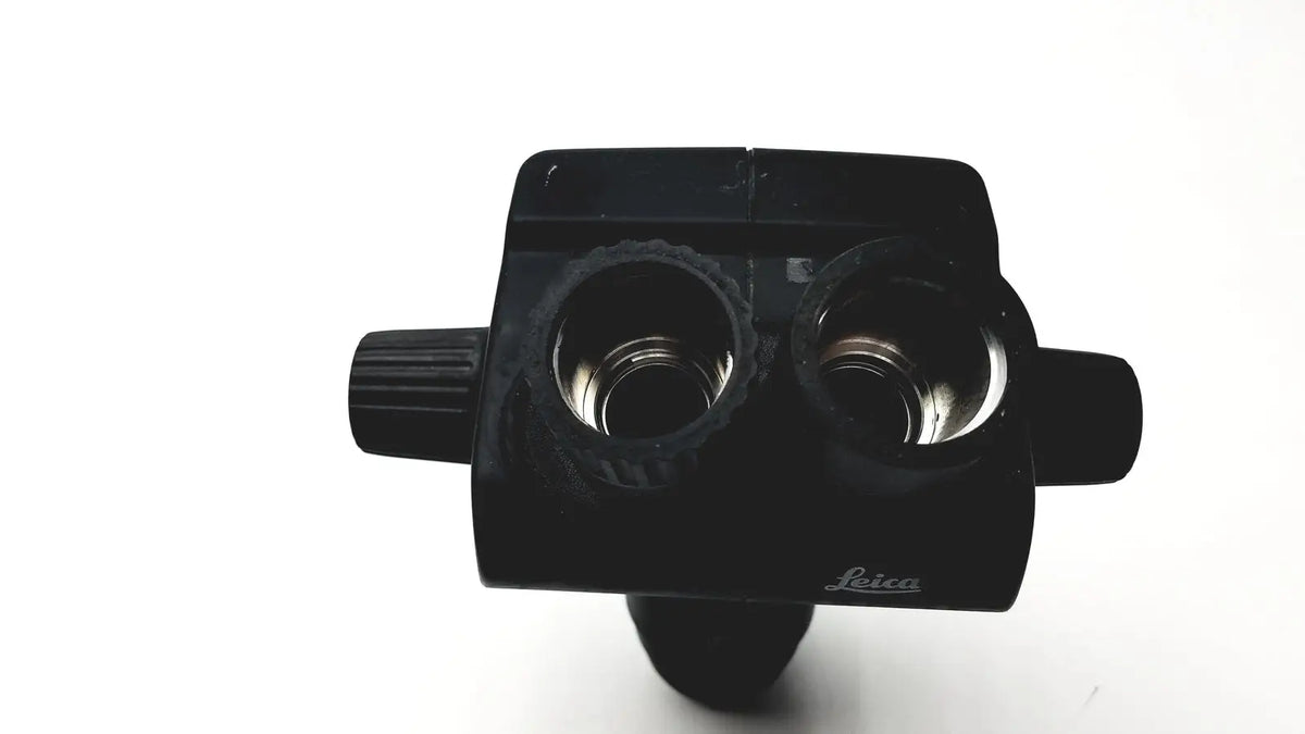Black leica gz6t stereo binoculars with two circular lenses and textured side knobs for gz6t stereo zoom microscope part