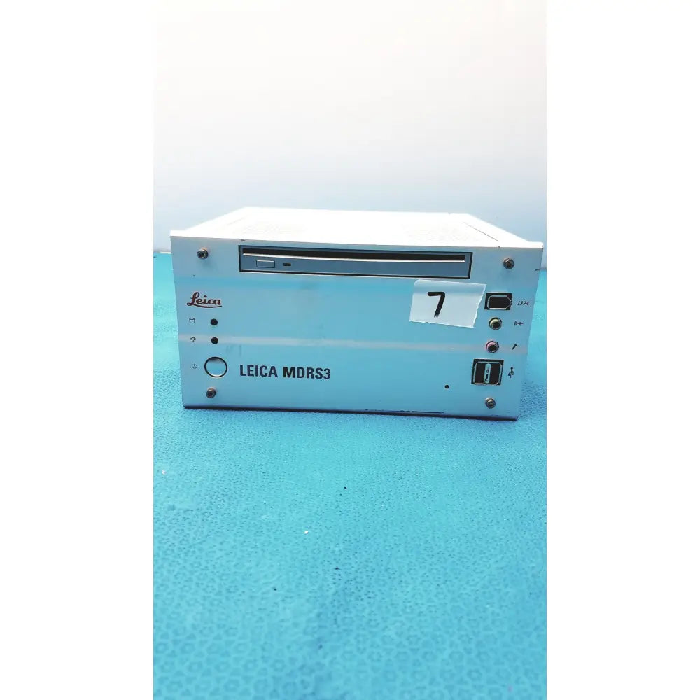 Light blue metallic leica mdrs4 medical digital video recorder showing silver cd-rom drive slot and various input output ports