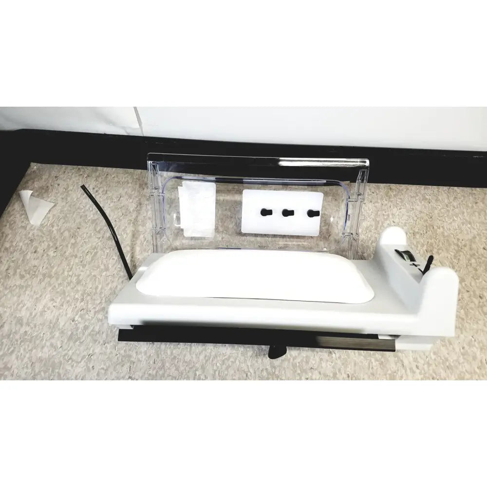 White plastic baby monitor base with clear acrylic cover and black cord for model h-2 pressure chambers use