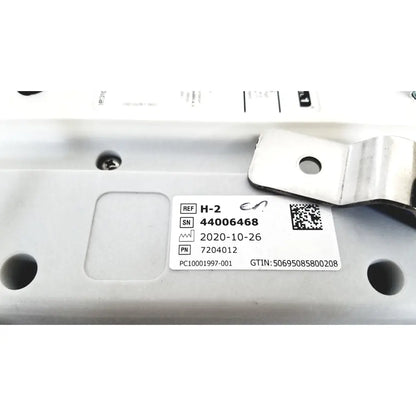 White rectangular label with black text and qr code on metallic surface of model h-2 pressure chambers