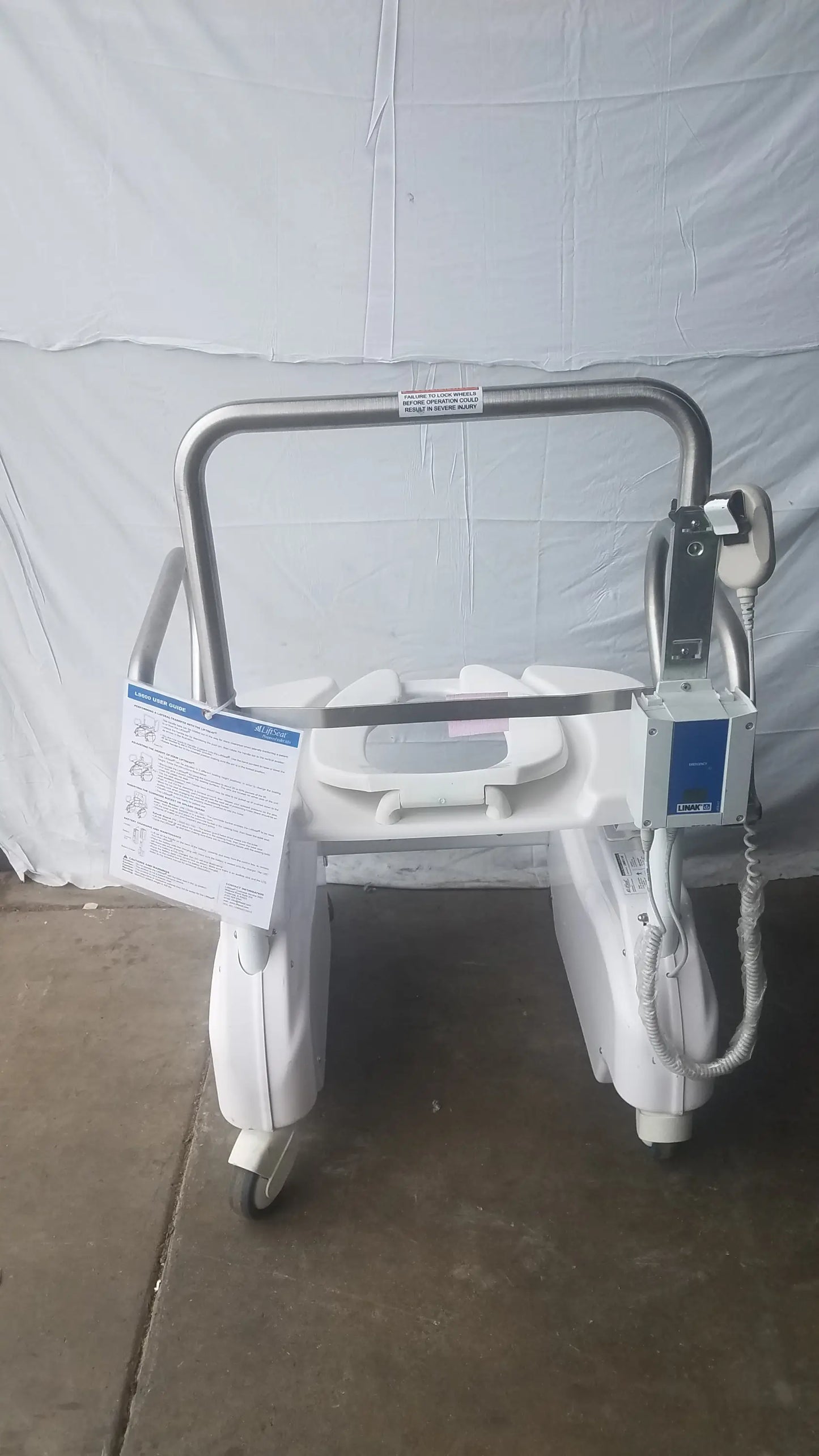 White bariatric power toilet lift chair with stainless steel frame and wheels liftseat ls600 model
