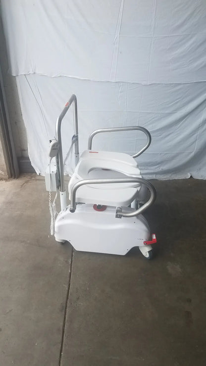 White liftseat LS600 bariatric power toilet lift with silver metal frame and wheels featuring accessible toilet seat design