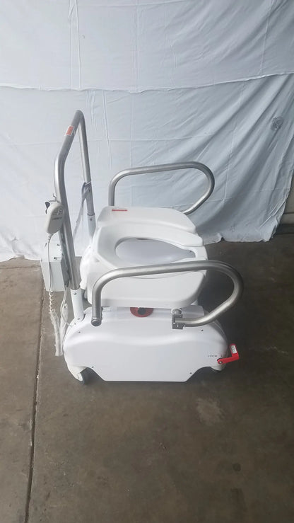 White bariatric power toilet lift with silver metal safety rails and wheels model liftseat ls600 sn ls66011186