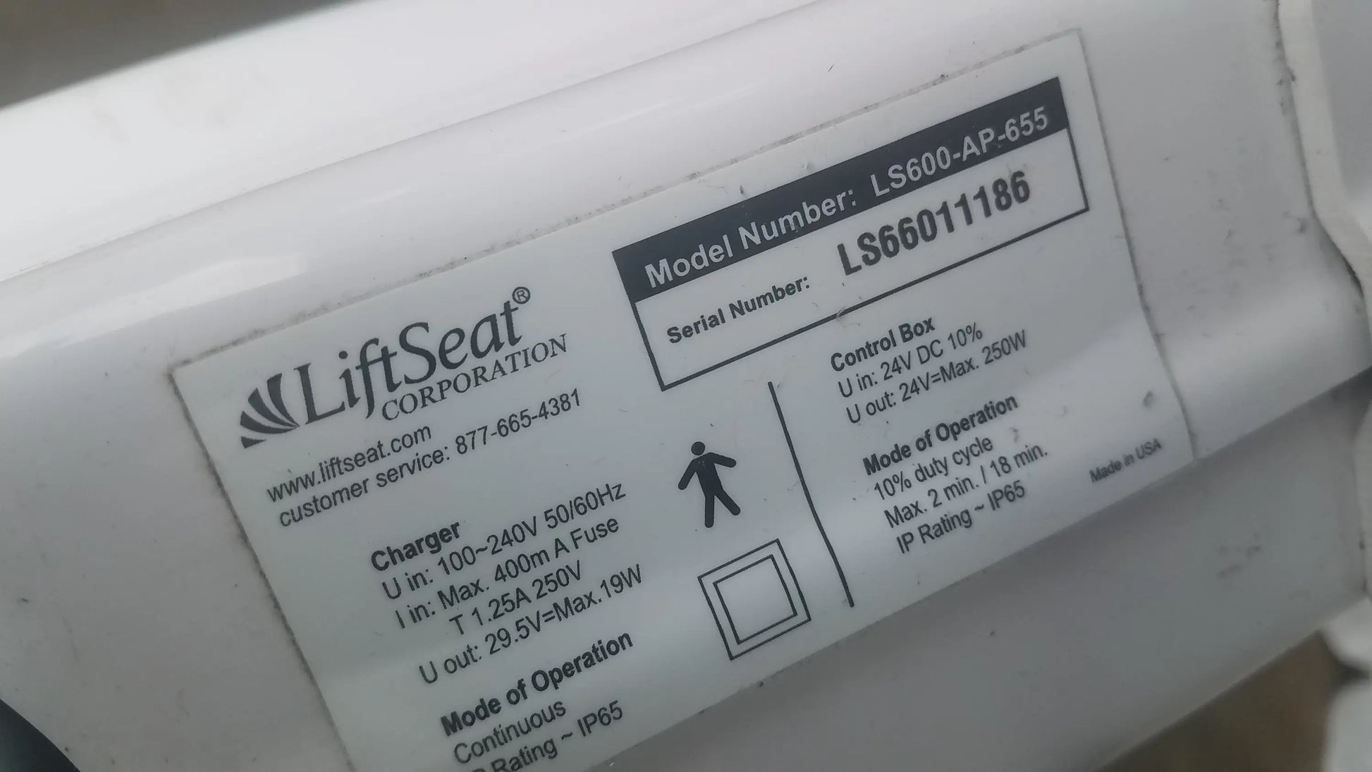 White plastic control box of liftseat corporation ls600-ap-655 model for bariatric power toilet lift ls66011186 serial number