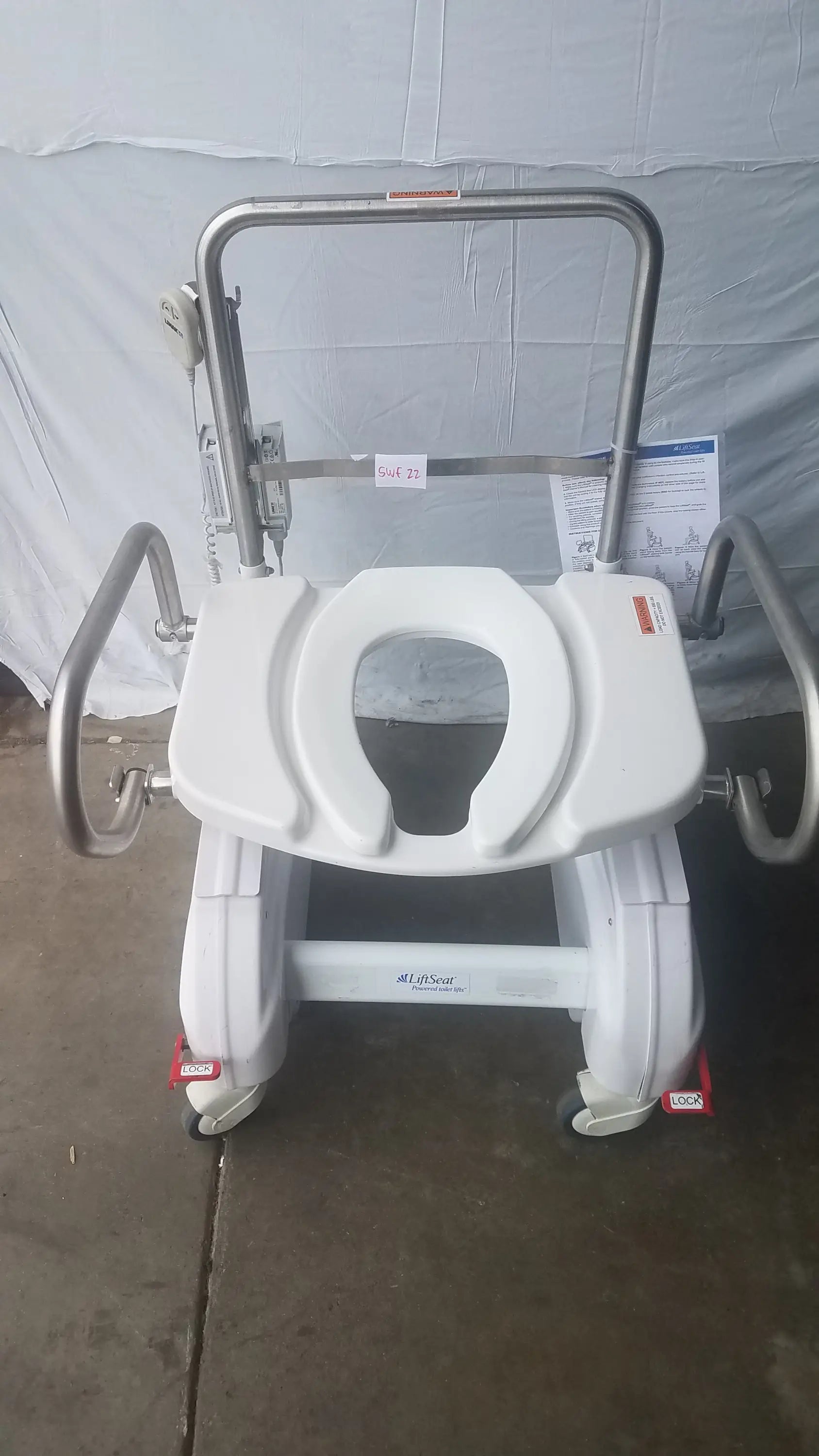 White plastic commode chair with stainless steel frame and side rails in liftseat ls600 bariatric power toilet lift