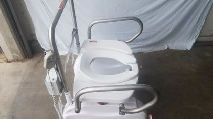 White LiftSeat LS600 bariatric power toilet lift with silver metal frame and handlebars for enhanced mobility