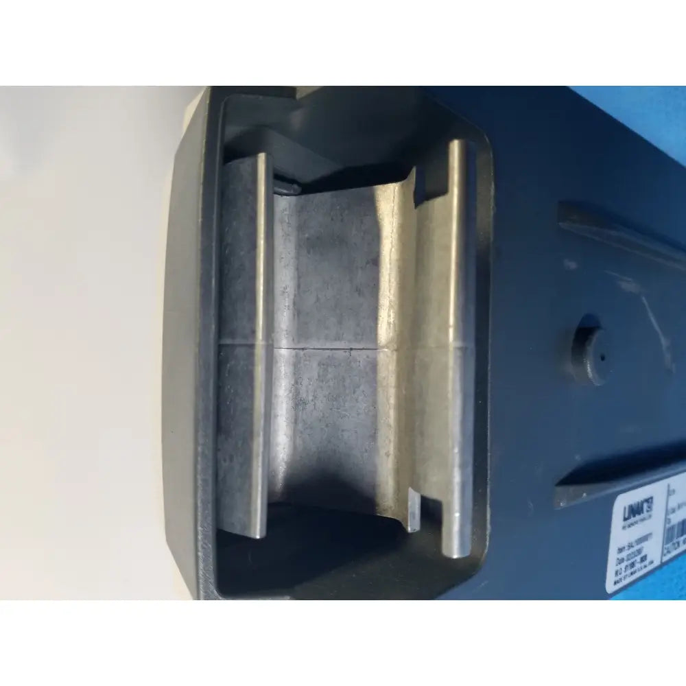 Black plastic housing with metallic silver guide rails inside the linak baj100000011 24v rechargeable battery for patient lift hoist